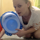 Sophie, a blonde girl from Poland, tells us in English that she does not want to use her regular toilet today. She proceeds to take a big shit in a plastic baby potty instead. Finished product and mess clearly shown. 720P HD. Over 9 minutes.